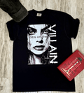 A woman wearing a black t-shirt with a graphic design and text Dips on the Villain.