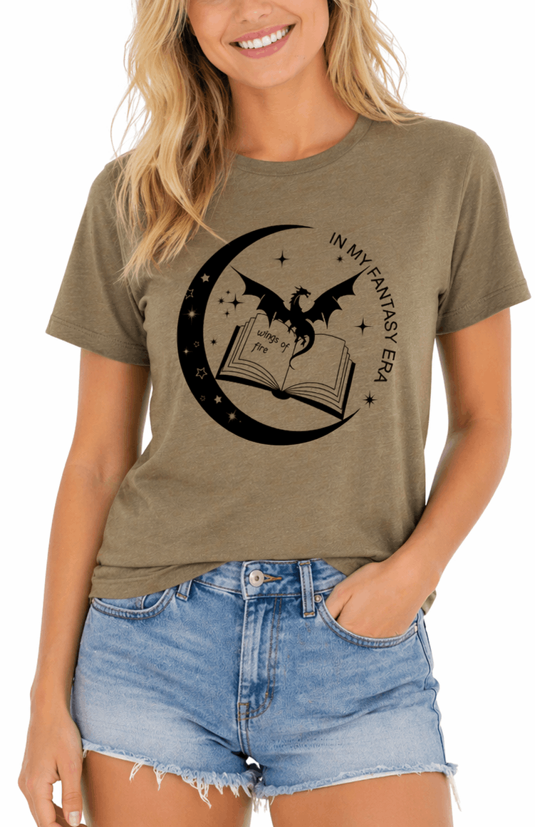 Woman wearing an olive green t-shirt with a dragon and book graphic, standing against a white background.
